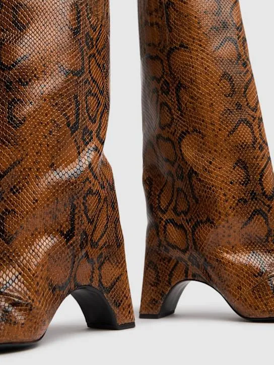 Coperni   85mm Snake print leather bridge boots 